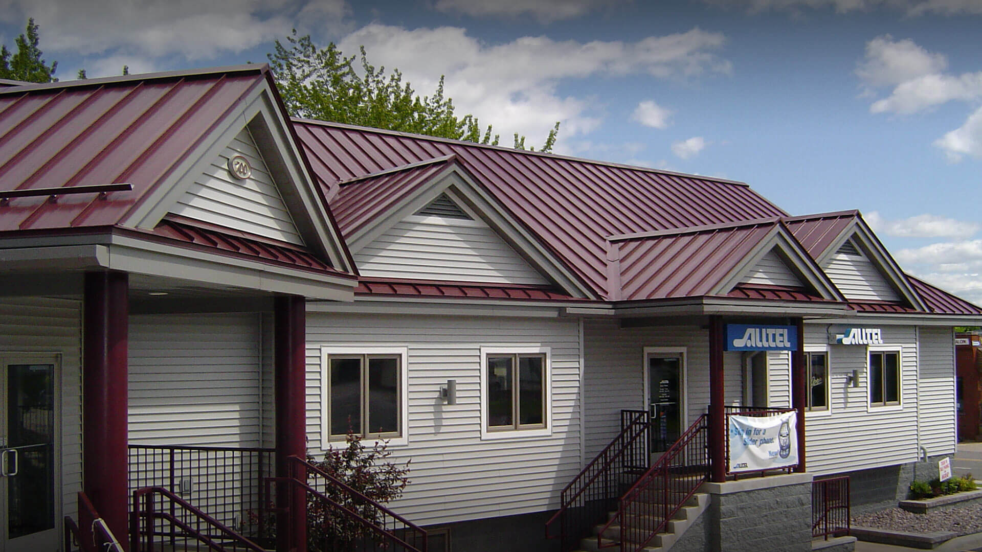 Maroon metal roof on a commercial building