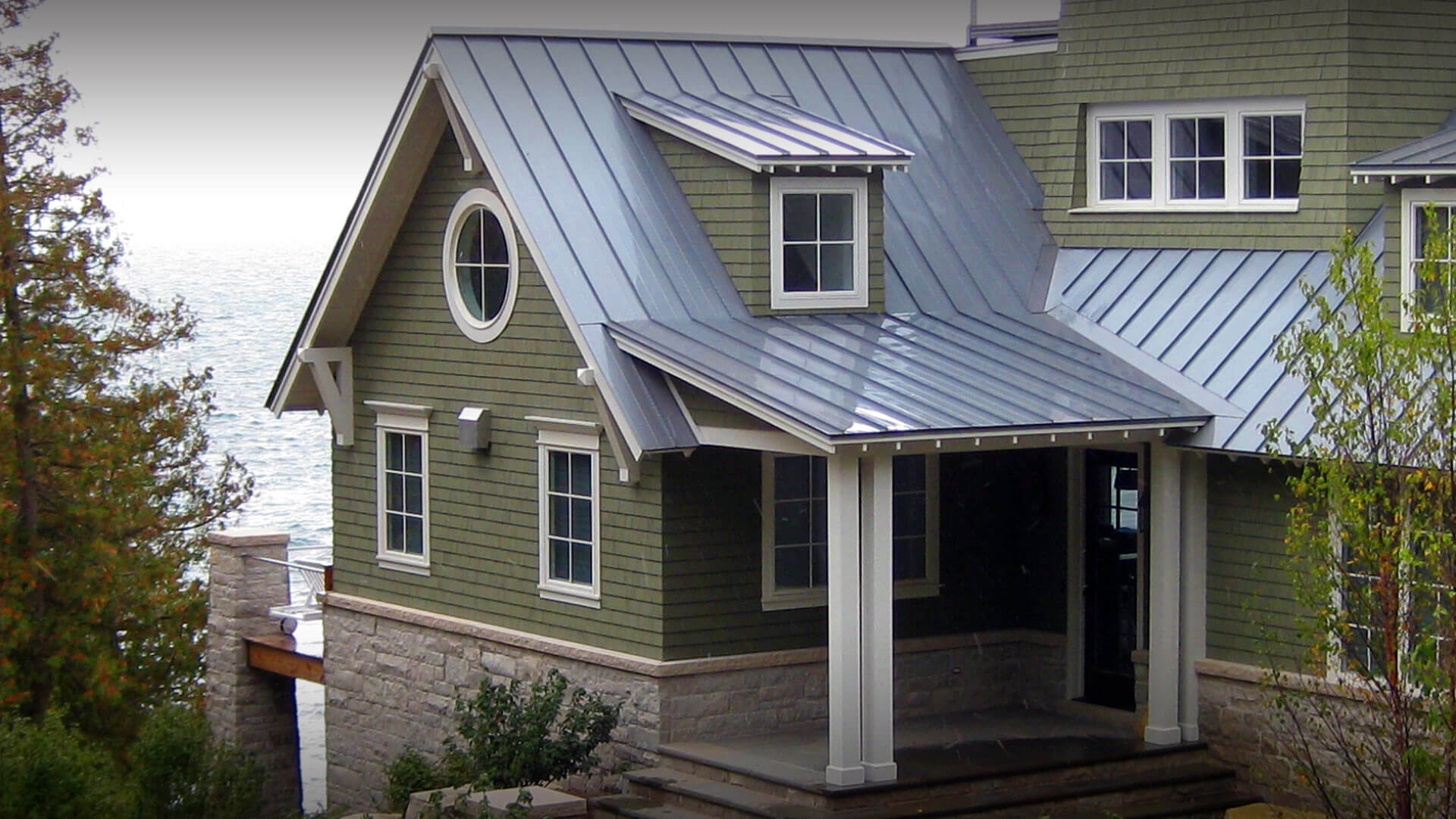 Green metal roof on a residential building.